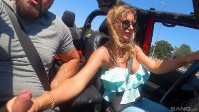 Slender blonde MILF plays with cock while driving - xbabe.com